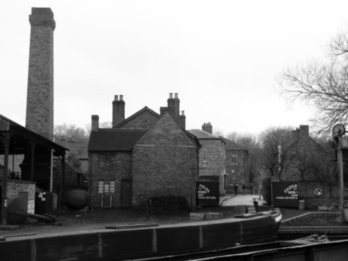 An image of the Black Country Living Museum - looking along Coppice street. The anchor forge is on the left and the lifting bridge on the right..